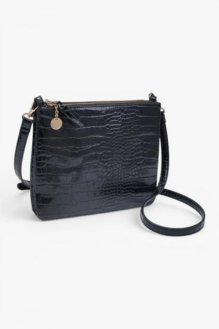 Black croc texture crossbody bag with gold hardware and structured silhouette