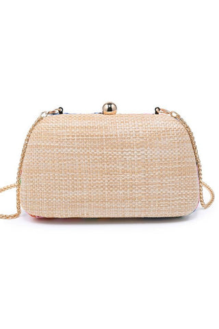 Beige woven handbag with a gold chain on a white background