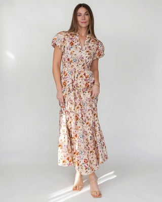 JO+CO Britton floral maxi dress in ecru with notched V-neck, elasticized waist, and tiered skirt. Made of cotton.