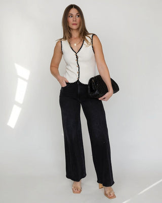 JO+CO cream knit vest with black scalloped trim and gold buttons, V-neck, sleeveless, fitted silhouette.